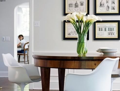 pairing modern chairs with vintage tables.